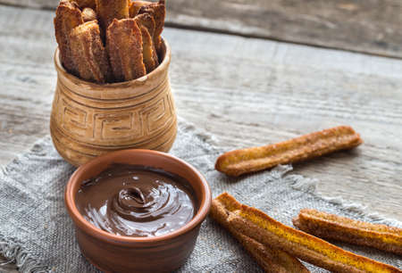 Churros - famous Spanish dessert with chocolate sauceの写真素材