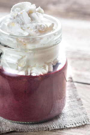 Bilberry smoothie with whipped creamの写真素材