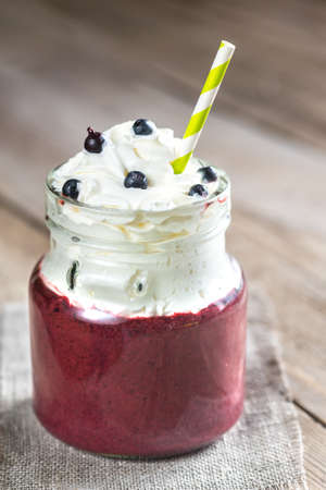 Bilberry smoothie with whipped creamの写真素材