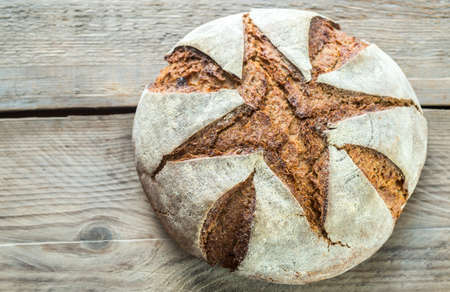Rye bread on the old-fashioned background