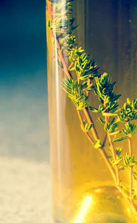 Bottle with olive oil on the old-fashioned backgroundの写真素材