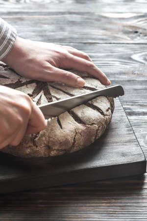Cutting of rye breadの写真素材