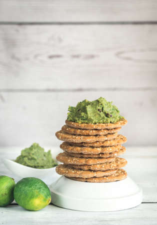 Sesame crispbread with guacamoleの写真素材