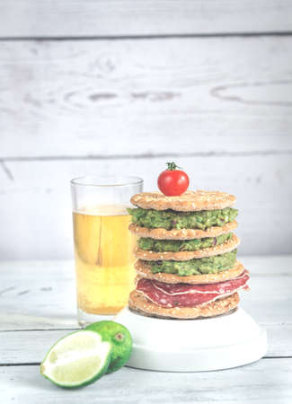 Glass of  beer with crispbread sandwichの写真素材