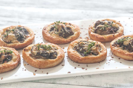 Tartelettes with shiitake mushrooms and cheeseの写真素材