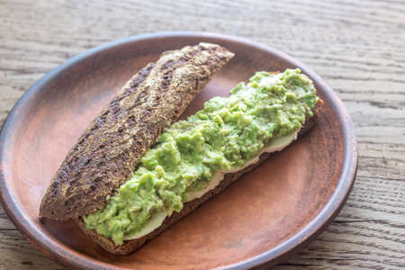 Sandwich with smashed avocadoの写真素材