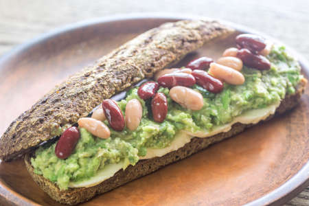 Sandwich with smashed avocado and kidney beansの写真素材