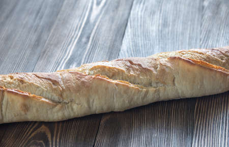 Baguette on the wooden background