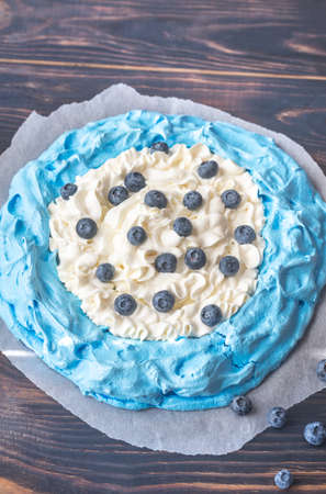 Meringue with whipped cream and fresh blueberriesの写真素材