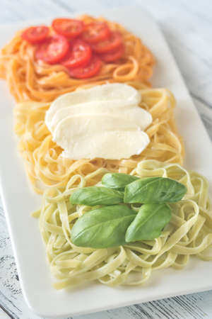 Tagliatelle with basil, mozzarella and cherry tomatoes