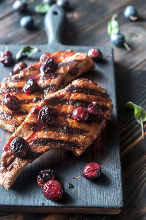 Grilled pork ribs on the wooden boardの写真素材