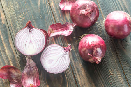 Red onions on the wooden backgroundの写真素材