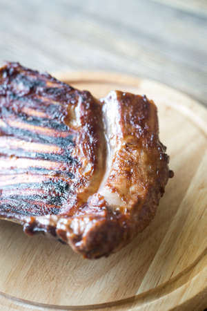 Grilled lamb ribs on the wooden board