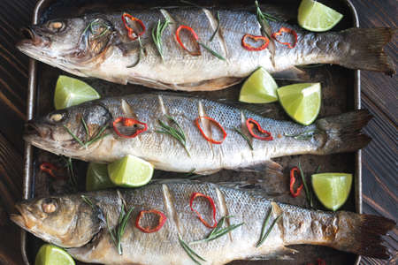 Baked sea bass with lime and chilli pepper