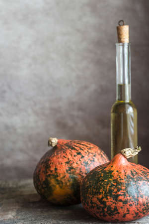 Two hokkaido pumpkins on the wooden backgroundの写真素材