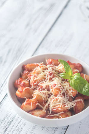 Potato gnocchi with tomato sauce and grated cheeseの写真素材