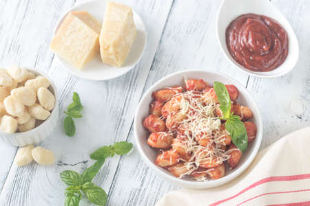 Potato gnocchi with tomato sauce and grated cheeseの写真素材