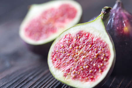 Fresh figs on the wooden background