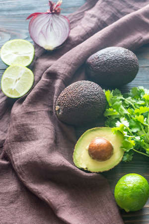 Hass avocados with ingredients for guacamoleの写真素材