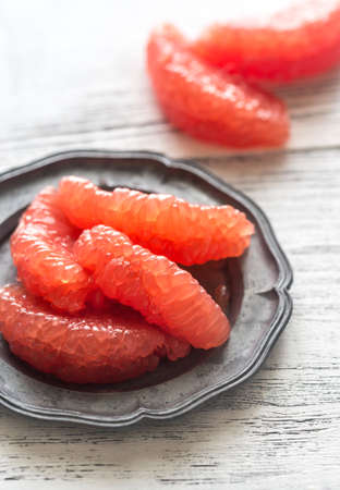 Peeled grapefruit on the tableの写真素材