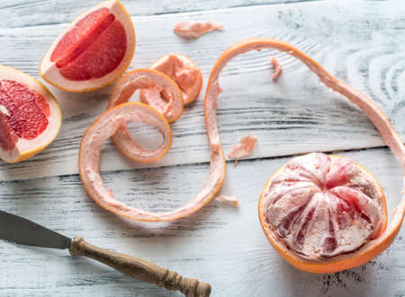 Peeled grapefruit on the tableの写真素材