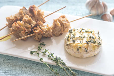 Camembert cheese fondue with toasted breadの写真素材