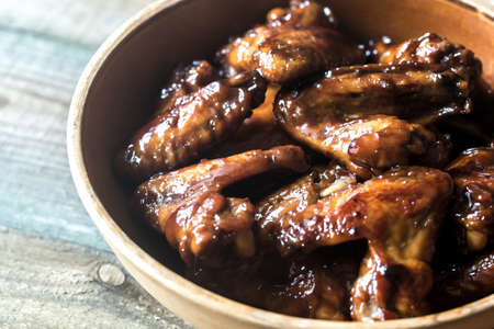 Bowl of teriyaki chicken wingsの写真素材