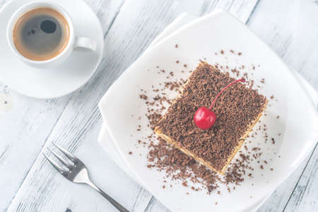 Tiramisu with chocolate topping on the white plate