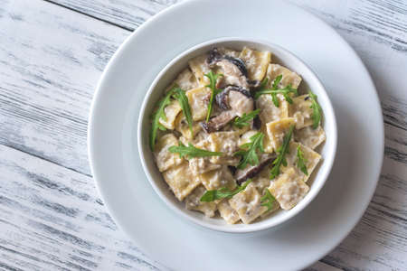Portion of creamy mushroom raviolettiの写真素材