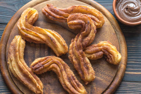 Churros with chocolate sauceの写真素材