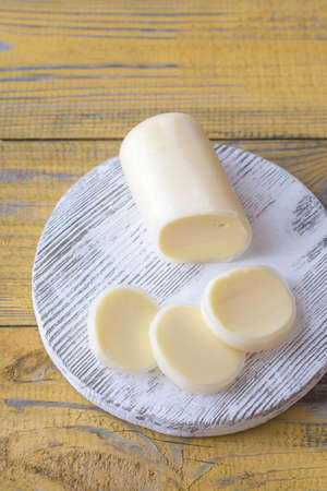 Sliced Formaggio on the wooden boardの写真素材