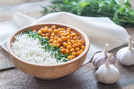 Bowl of chickpea curry with white rice and fresh cilantroの写真素材