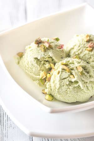 Pistachio ice cream in the bowlの写真素材