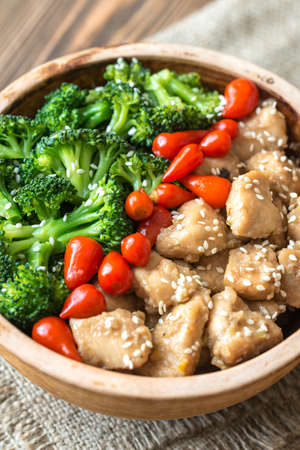 Bowl of broccoli and chicken stir-fryの写真素材