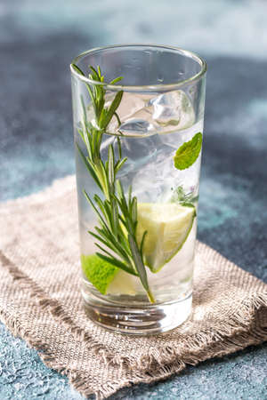 Glass of lime water with herbsの写真素材