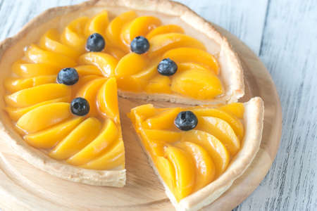Tart with peaches and blueberry