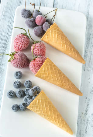 Frozen berries in waffle cones
