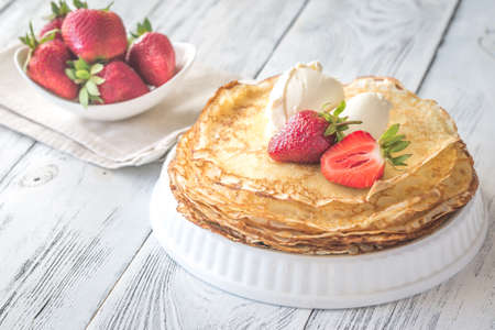 Crepes with cream cheese and fresh strawberriesの写真素材