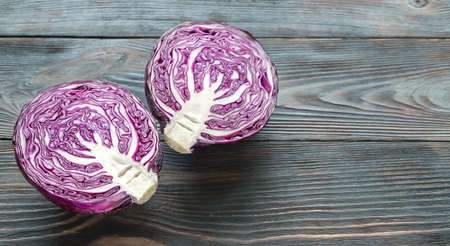 Halved red cabbage on the wooden backgroundの写真素材