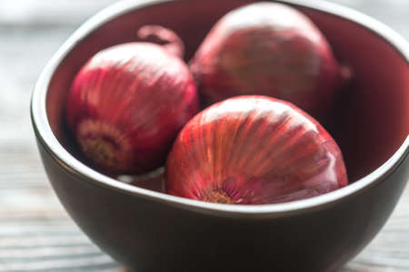 Bowl of red onionsの写真素材
