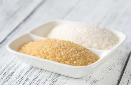 Bowl of white and brown sugar
