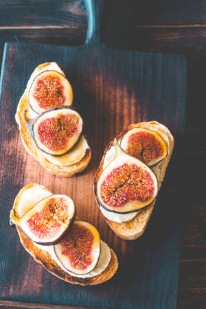 Toasts with cheese and figsの写真素材