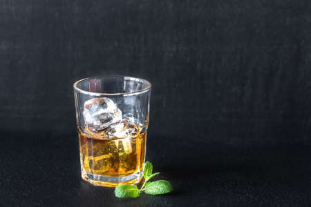 Glass of rum on the dark backgroundの写真素材