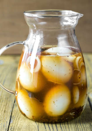 Pickled eggs in the glass jugの写真素材