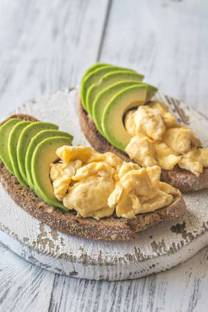 Sandwiches with avocado and scrambled eggsの写真素材