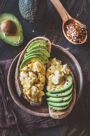 Sandwiches with avocado and scrambled eggsの写真素材