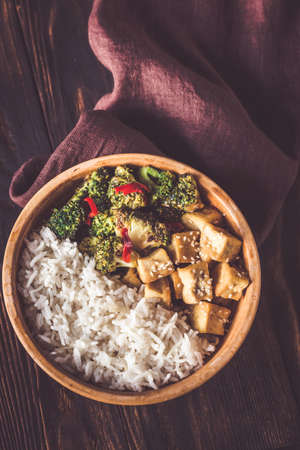Tofu and broccoli stir-fry with white riceの写真素材