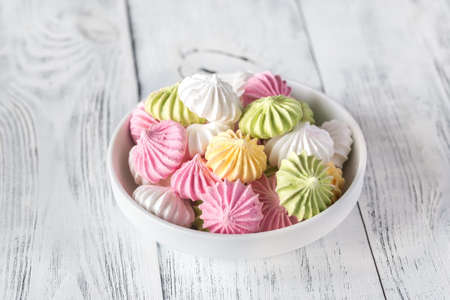 Bowl of colored meringuesの写真素材