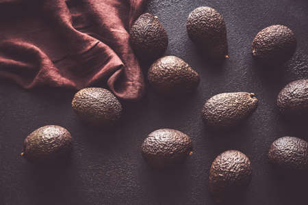 Hass avocados on the dark background