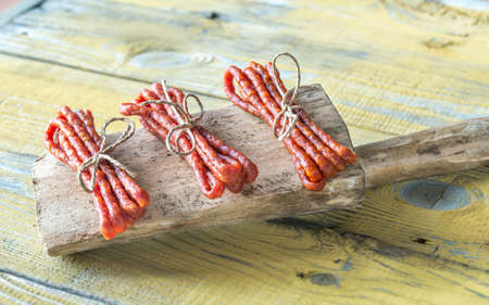 Kabanosy sausages on the wooden backgroundの写真素材